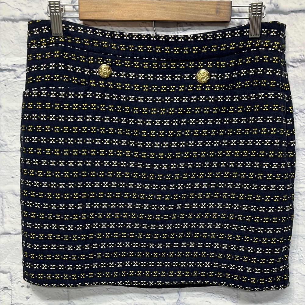 Outback Red mini skirt. Navy with yellow and white detailing.